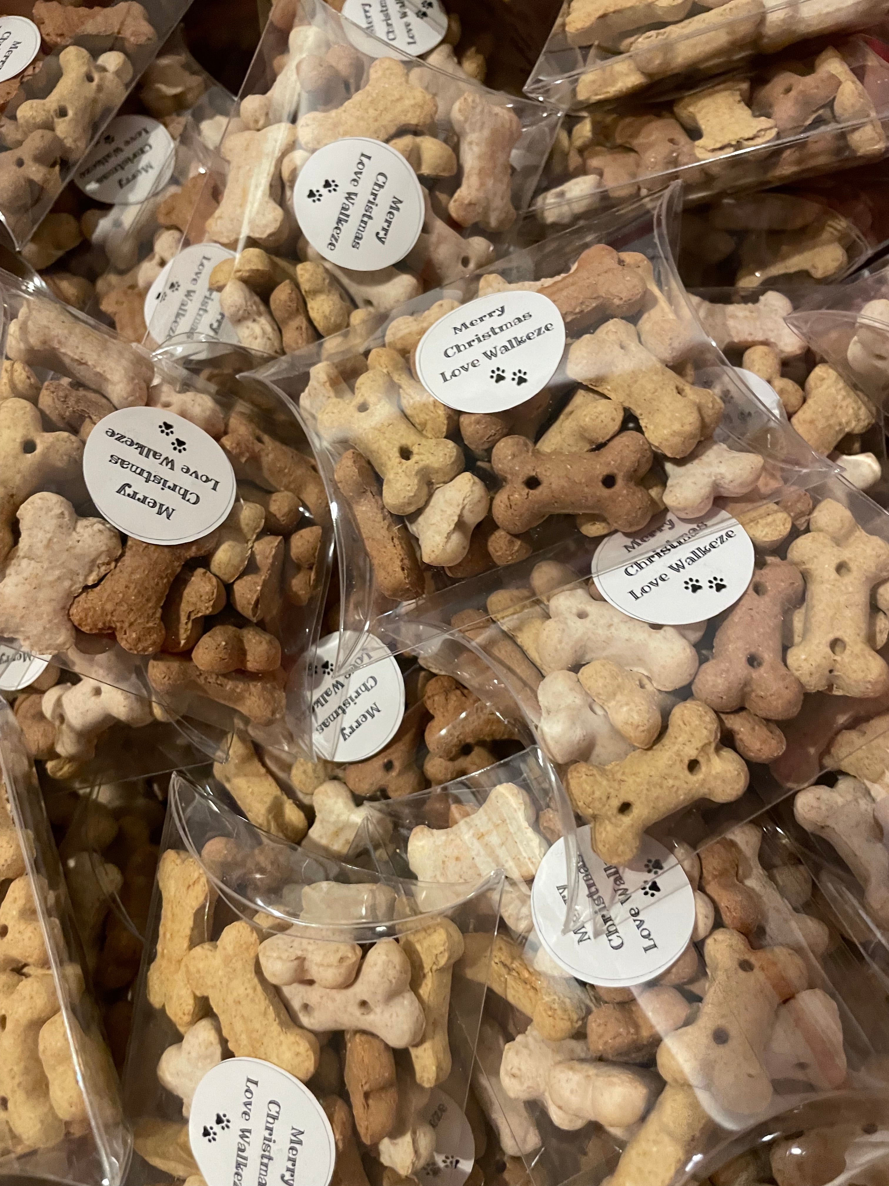 Packaged dog treats shaped like bones with visible brand name on labels.