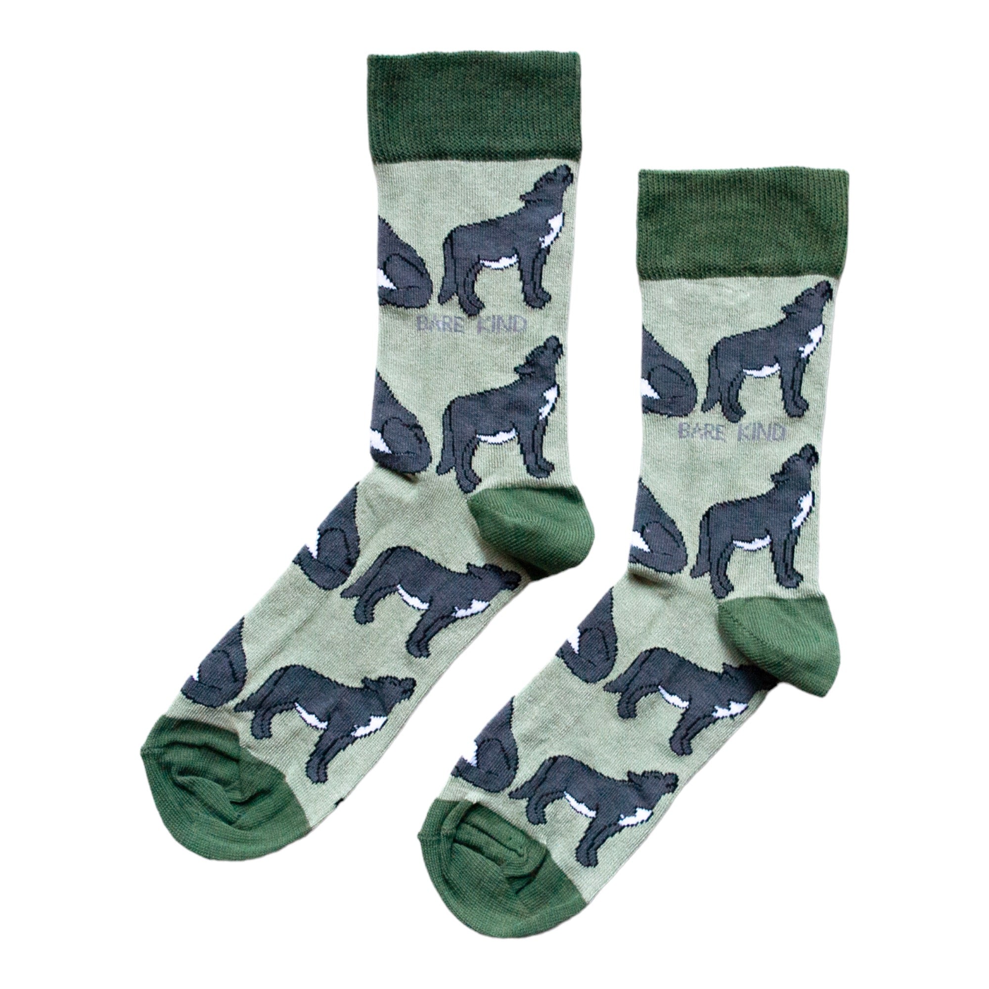 Pair of socks with wolf design on a light green background