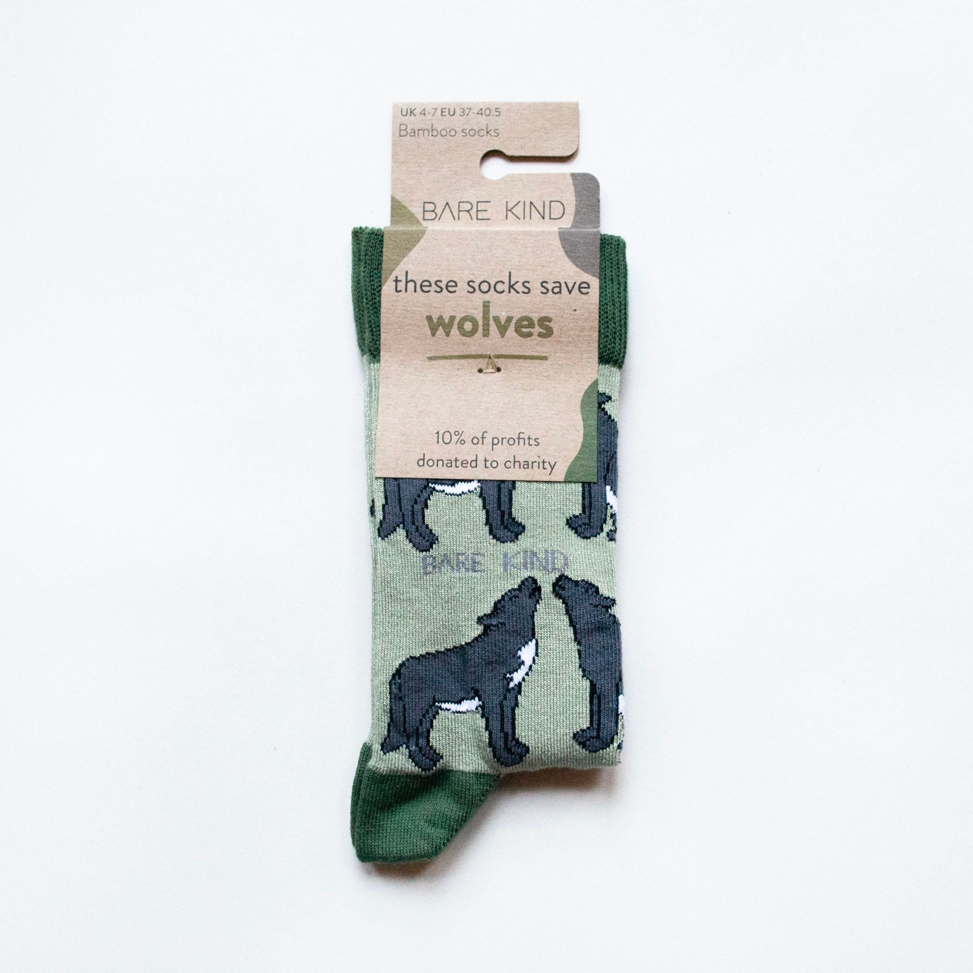 Green sock with wolf design and Bare Kind packaging on a white background