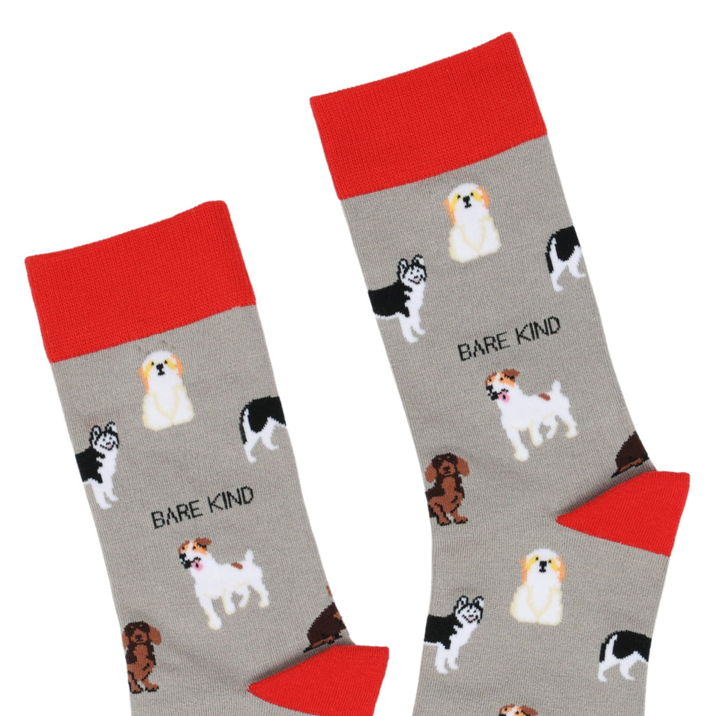 Gray socks with dog illustrations and red tops, featuring the brand 'Bare Kind'.