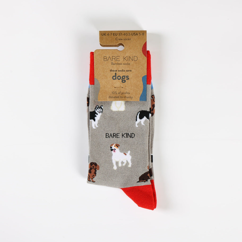 Packaged socks with dog illustrations and 'Bare Kind' branding on a white background