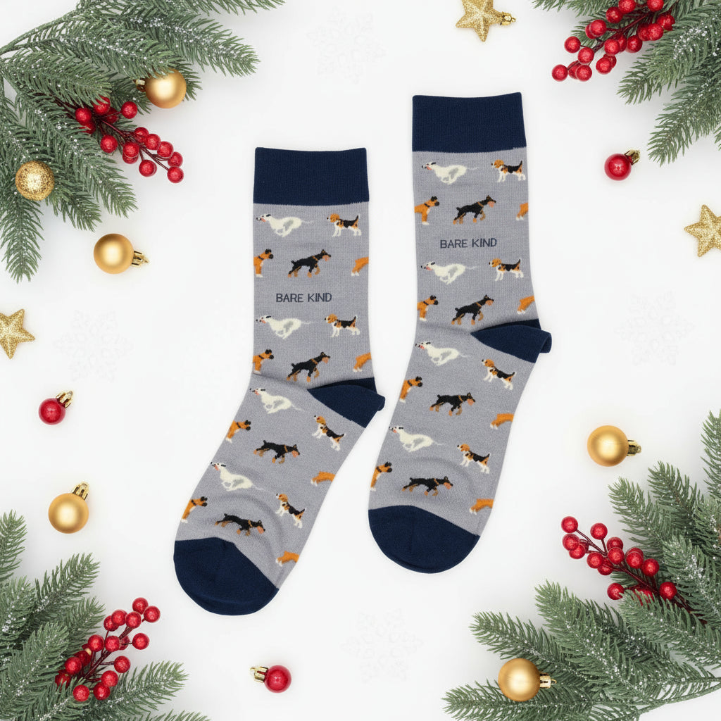 Pair of socks with dog pattern and 'Bare Kind' text on a gray background